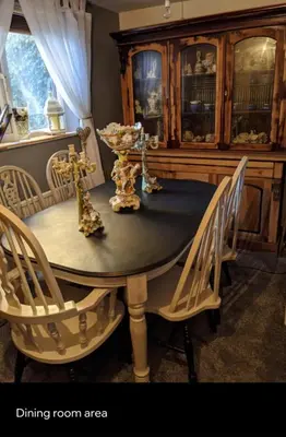 a dining room table with chairs and a dining room area at Quaint & Quirky House Colchester Town Centre in Colchester