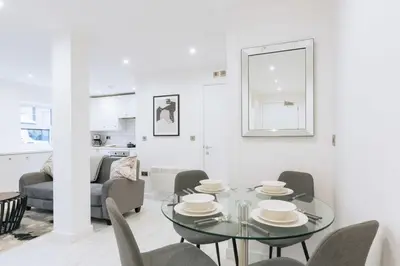 a dining room with a glass table and chairs at Budget 1 Bedroom Apartment in Central Ipswich in Ipswich