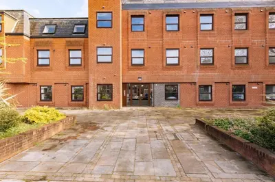 a brick building with a courtyard in front of it at Budget 1 Bedroom Apartment in Central Ipswich in Ipswich
