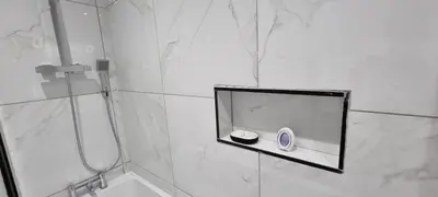 a bathroom with a shower with a mirror and a sink at ED Colchester Accommodation with Garden View in Colchester
