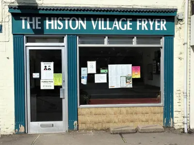 a building with a sign that reads the mission village river at Old Station Apartments in Cambridge