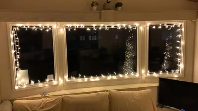 a window with christmas lights in a living room at 5 mins walk to beach. 3 bedroom caravan. Sleeps 8 in Clacton-on-Sea
