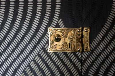 a brass door knocker is on the floor at Staycations Maldon in Maldon