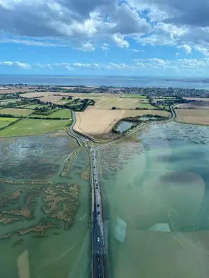 an aerial view of a bridge over a river at Island Retreat with HotTub in West Mersea