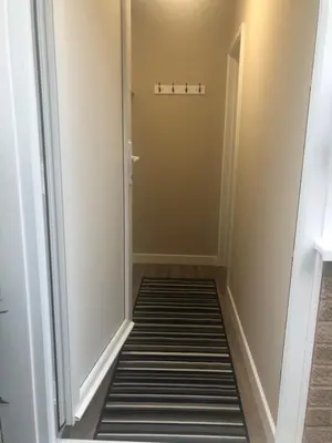 a hallway leading into a room with a door at The Annexe II in Mildenhall