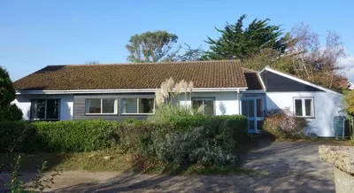 a white house with a brown roof at Sea Poppies in Thorpeness
