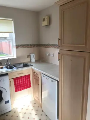 a kitchen with a sink and a dishwasher at Grant Close in Wickford