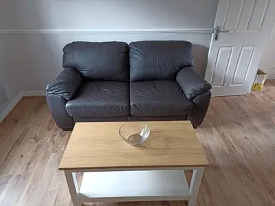 a living room with a couch and a coffee table at Grant Close in Wickford
