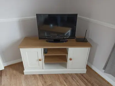 a tv sitting on top of a white cabinet at Grant Close in Wickford