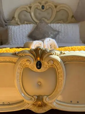 a close up of a bed with an ornateitures at Barnfields Retreat in Little Clacton