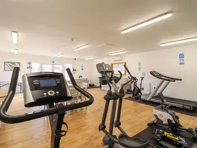 a gym with several treadmills and exercise bikes at Lodge 47 in Ipswich