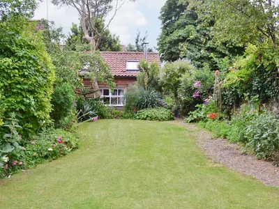 a garden in front of a house at Lavender Cottage in Methwold