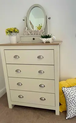 a dresser with a mirror on top of it at Stylish Boutique Bungalow in Felixstowe