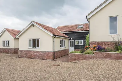 an image of a house at Grove Farm Bungalow with swimming pool, Dallinghoo in Woodbridge
