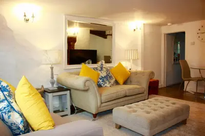 a living room with two couches and a tv at Romantic* Castle on the Hill Cottage *Framlingham in Framlingham