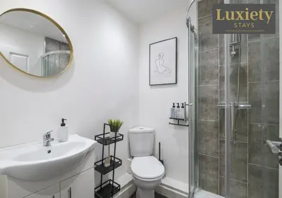 a bathroom with a toilet and a sink and a shower at Stylish 1BR By Luxiety Stays Short Lets & Serviced Accommodation Southend on sea - Near High St & Southend Beach in Southend-on-Sea