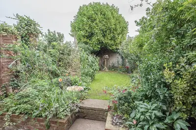 a garden with trees and plants and a yard at North Cottage, Alderton in Woodbridge