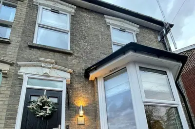 a brick house with a front door with a wreath on it at Refurbished Victorian Villa- Free Parking- Sleeps6 in Bury Saint Edmunds