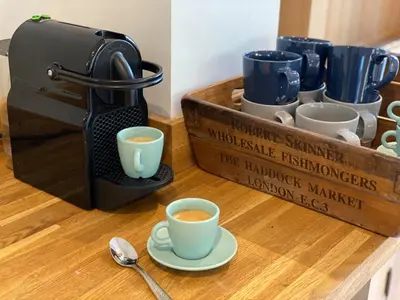 a coffee maker and two cups on a table at Refurbished Victorian Villa- Free Parking- Sleeps6 in Bury Saint Edmunds