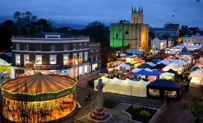 a city with a christmas market at night at Refurbished Victorian Villa- Free Parking- Sleeps6 in Bury Saint Edmunds
