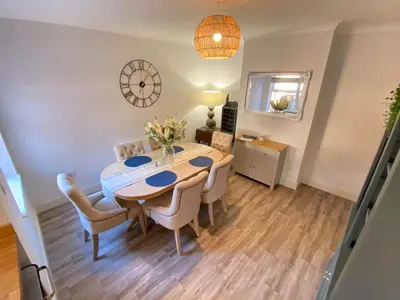 a dining room with a table and chairs at Refurbished Victorian Villa- Free Parking- Sleeps6 in Bury Saint Edmunds