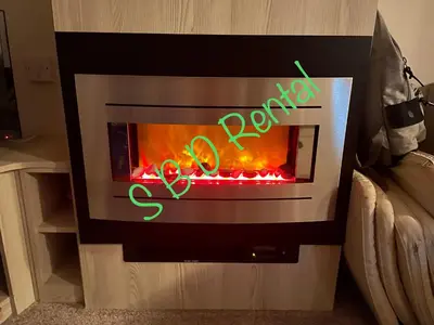 a fire oven with the word approval written on it at Summer Breeze Deluxe Caravan Rental in Saint Osyth