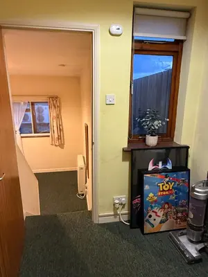 an entrance to a room with a fish tank next to a door at Cosy central 1 bedroom flat near city centre & station in Cambridge