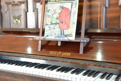 a picture sitting on top of a piano at Yew Tree Farm Barn, Worlingworth in Worlingworth