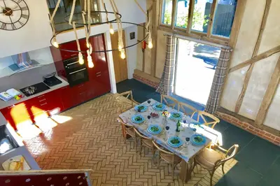 an overhead view of a dining table in a room at Yew Tree Farm Barn, Worlingworth in Worlingworth