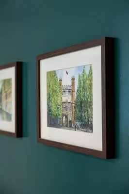 a picture of a building hanging on a wall at The Black Horse in Swaffham Bulbeck