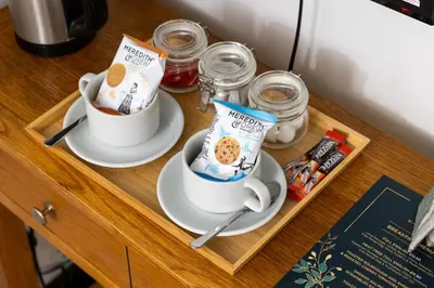 a tray with two cups of coffee on a table at The Black Horse in Swaffham Bulbeck