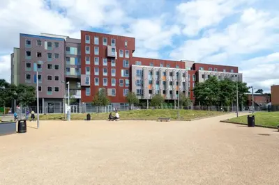 a group of buildings in front of a park at For Students Only Collegiate Athena Hall Ipswich in Ipswich