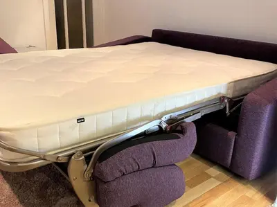 a mattress on top of a bed on a couch at Gulliver's Cottage in Frinton-On-Sea in Frinton-on-Sea