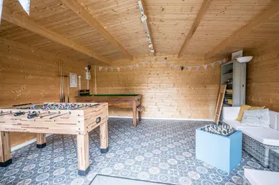 a room with a ping pong table in a room at The Cartlodge Boundary Farm, Framlingham in Woodbridge