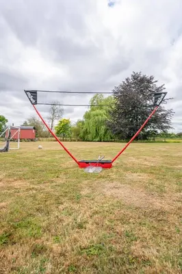 a net in the middle of a field at Sage Shepherds Hut Boundary Farm, Framlingham in Woodbridge