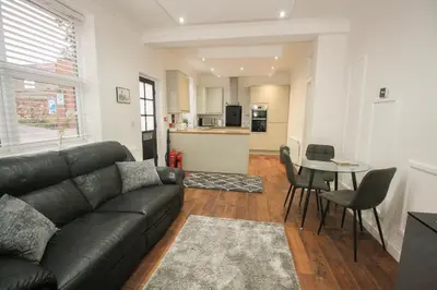 a living room with a couch and a table at Roman Quarter in Colchester