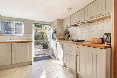 a kitchen with white cabinets and a counter top at 1 Bed in Woodbridge oc-11ang in Woodbridge