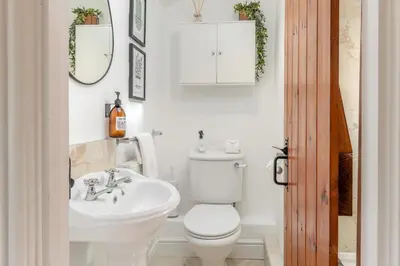 a white bathroom with a toilet and a sink at 1 Bed in Woodbridge oc-11ang in Woodbridge