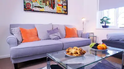 a living room with a couch and a glass table at FREE parking, Central Location,1 Bedroom Apartment near Tattersalls in Newmarket