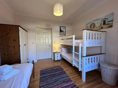 a bedroom with two bunk beds and a bed at 2 Bed in Blythburgh oc-wag2 in Blythburgh