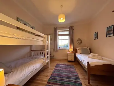 a bedroom with two bunk beds and a window at 2 Bed in Blythburgh oc-wag2 in Blythburgh