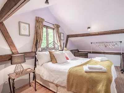 a bedroom with a bed and a window at John Fanner Barn - Uk37102 in Mellis