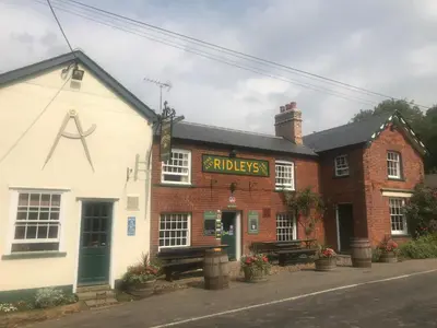 a building with a sign on the front of it at The Compasses in Chelmsford