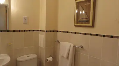 a bathroom with a toilet and a sink at Citystay Living- Warren Close in Cambridge