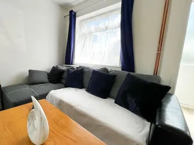 a living room with a couch and a window at Starview Apartment - Hawthorne in Colchester