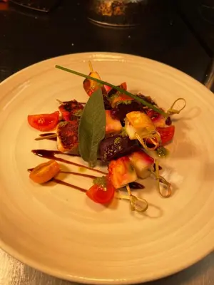 a white plate of food on a table at The Hole In The Wall in Little Wilbraham