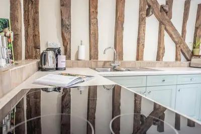 a kitchen with a counter top with a sink at Harvest Cottage, Valley Farm, Snape in Saxmundham
