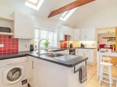 a kitchen with a sink and a dishwasher at The Croft in Thetford