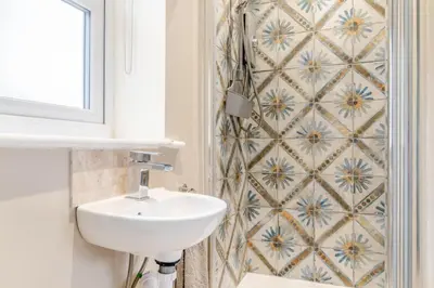 a bathroom with a sink and a tiled wall at 2 Bed in Bentley oc-thpo in Bentley
