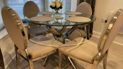 a glass table with chairs and a vase of flowers at One Bedroom Flat Town Centre Colchester in Colchester
